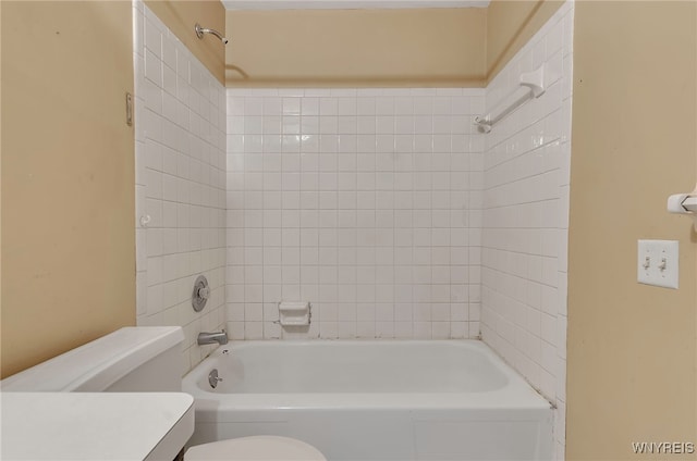 full bathroom with vanity, toilet, and tiled shower / bath