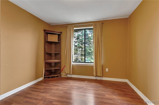 empty room featuring hardwood / wood-style flooring