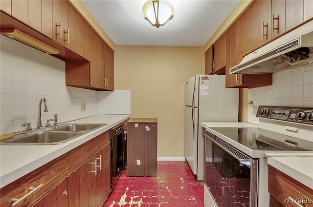 kitchen featuring decorative backsplash, sink, and white appliances