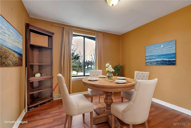 dining room with dark wood-type flooring