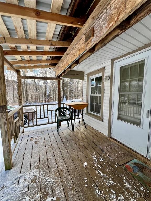 view of snow covered deck