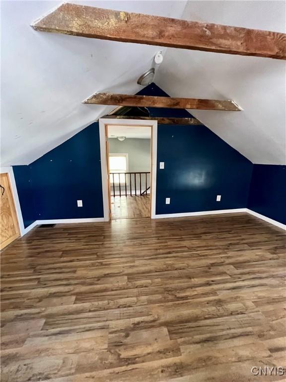 bonus room with vaulted ceiling with beams and hardwood / wood-style floors