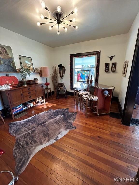 interior space with an inviting chandelier and dark wood-type flooring