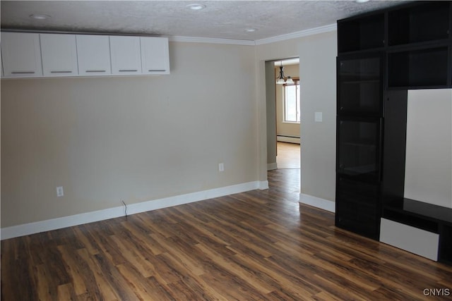 interior space with dark hardwood / wood-style flooring, ornamental molding, a textured ceiling, and a baseboard heating unit