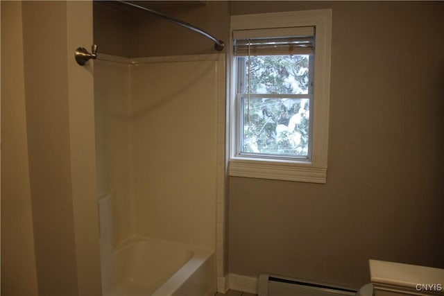 bathroom featuring shower / washtub combination and a baseboard radiator