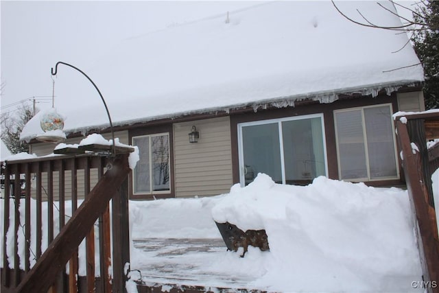 view of snow covered property entrance