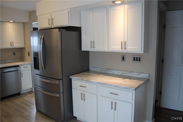 kitchen featuring white cabinetry and appliances with stainless steel finishes