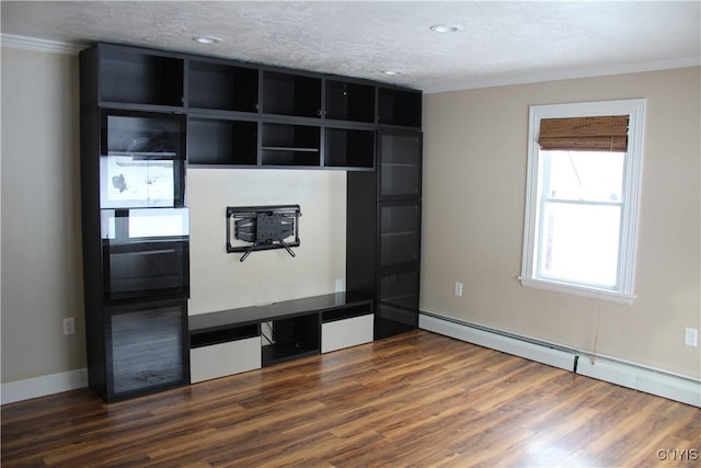 unfurnished living room with a baseboard heating unit, a textured ceiling, ornamental molding, and dark wood-type flooring