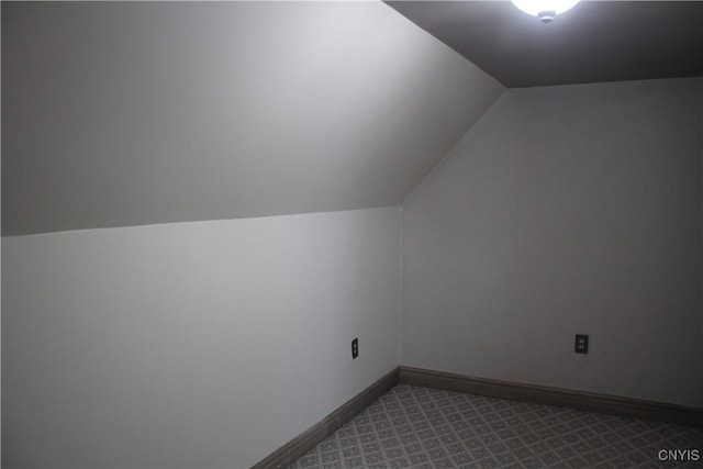 bonus room featuring carpet flooring and lofted ceiling