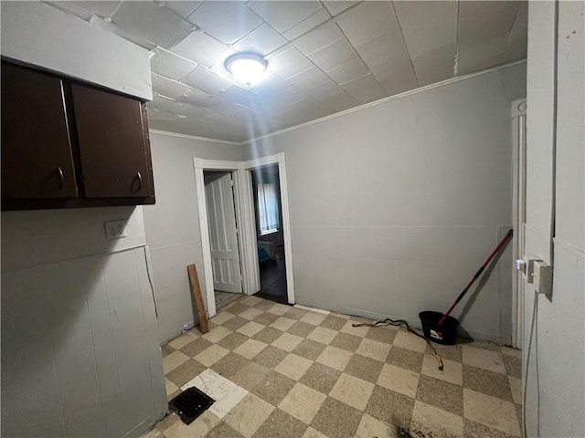 laundry room with crown molding