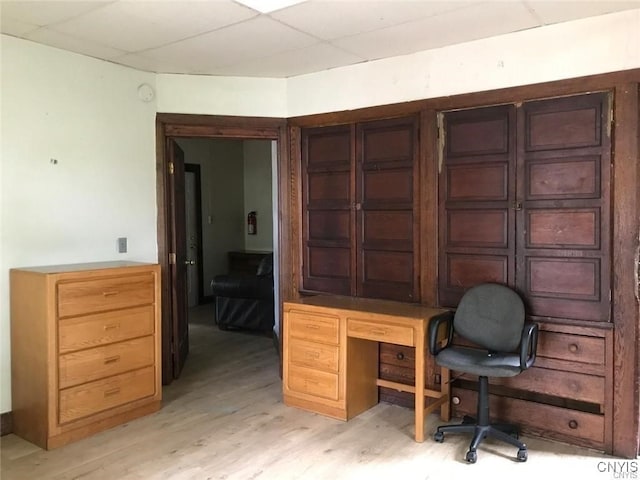 office space featuring a drop ceiling and light hardwood / wood-style floors