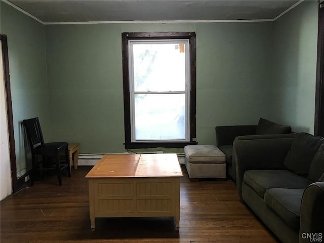 living room featuring baseboard heating, crown molding, and dark hardwood / wood-style floors