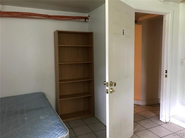 unfurnished bedroom featuring light tile patterned floors