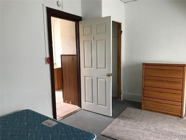 unfurnished bedroom featuring light carpet