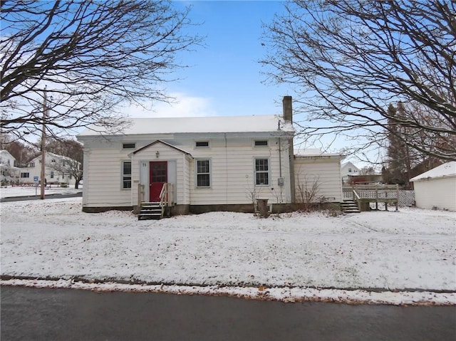 view of snow covered house