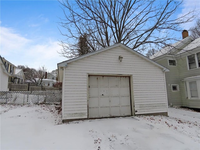 view of snow covered garage