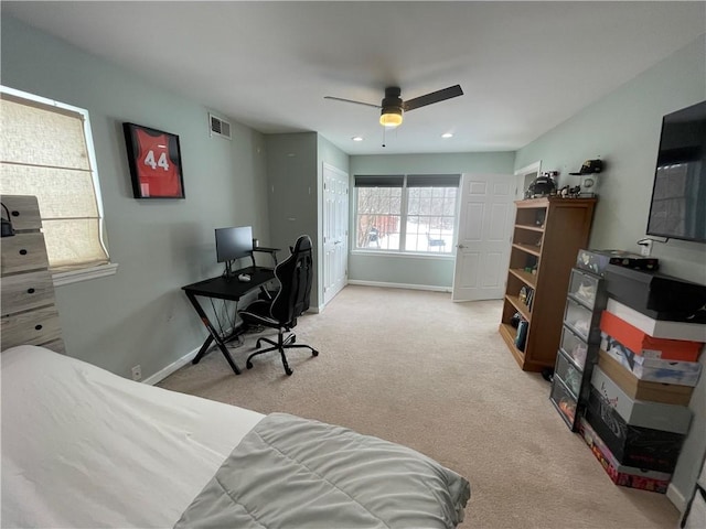 bedroom featuring ceiling fan and light colored carpet