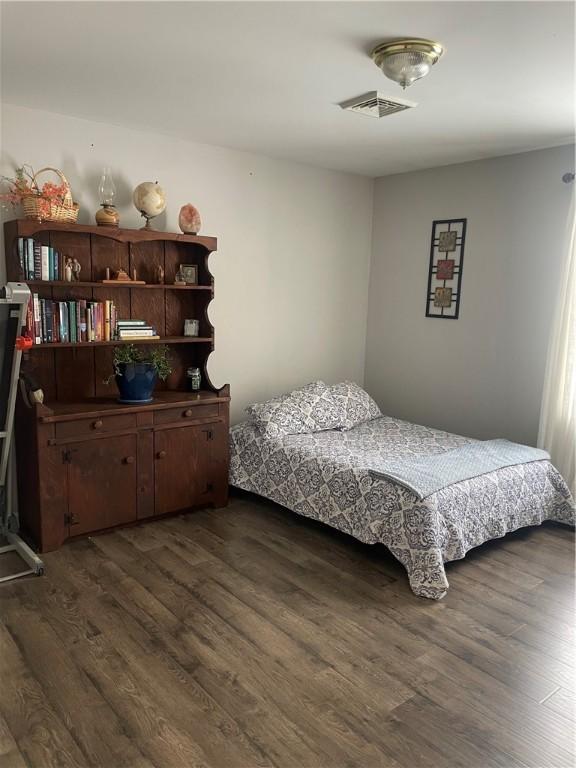 bedroom featuring dark hardwood / wood-style floors