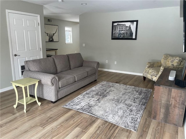 living room with light hardwood / wood-style floors