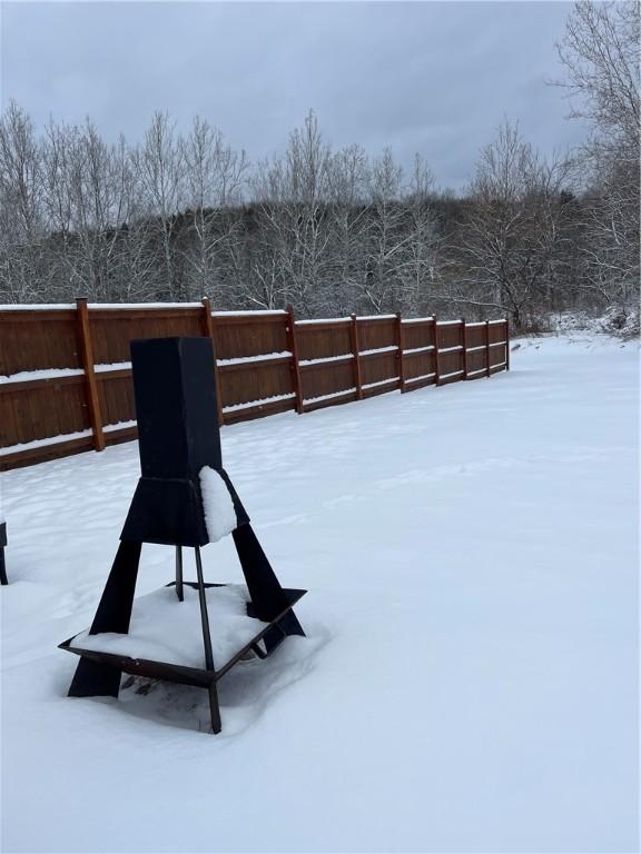 view of yard layered in snow