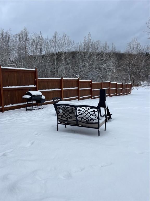 view of yard layered in snow