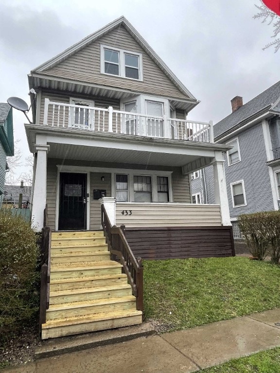 view of front of property with a balcony