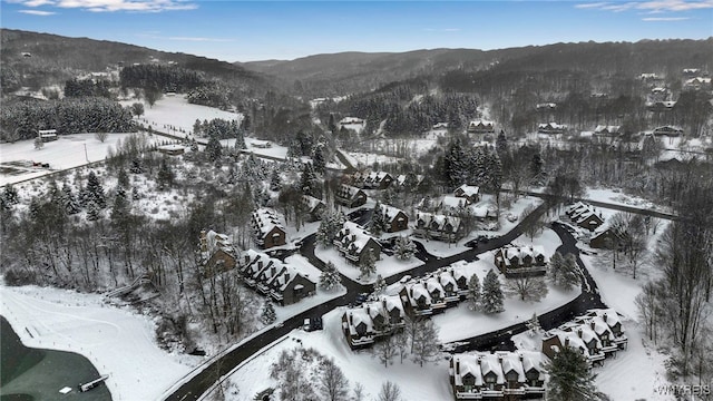 snowy aerial view with a mountain view