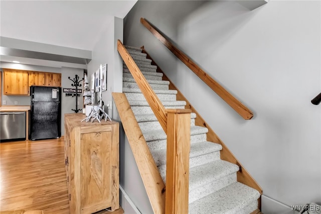 stairway with wood-type flooring