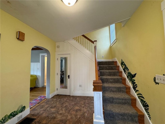 stairway with hardwood / wood-style flooring