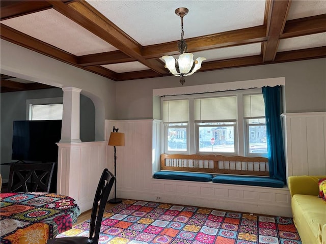 dining room with plenty of natural light and coffered ceiling