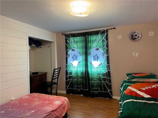 bedroom with hardwood / wood-style floors