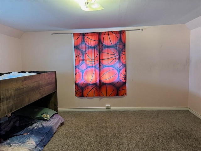 carpeted bedroom with lofted ceiling