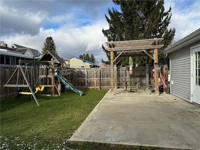 view of play area with a patio and a lawn