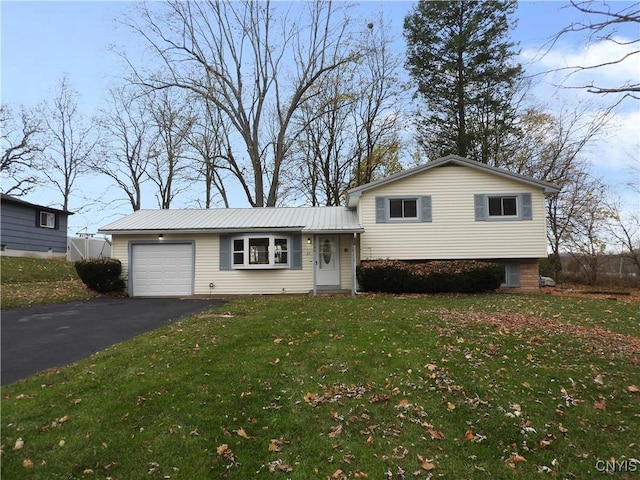 split level home with a front yard and a garage