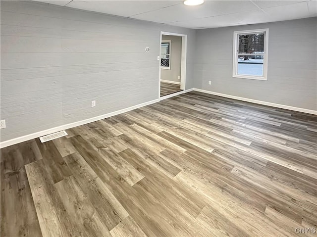 unfurnished room featuring hardwood / wood-style flooring