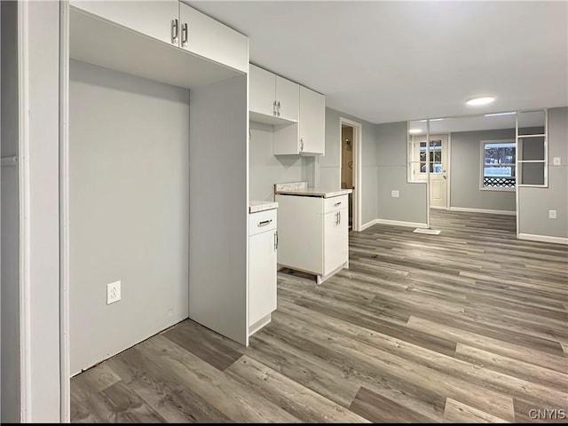 kitchen featuring white cabinets and dark hardwood / wood-style floors