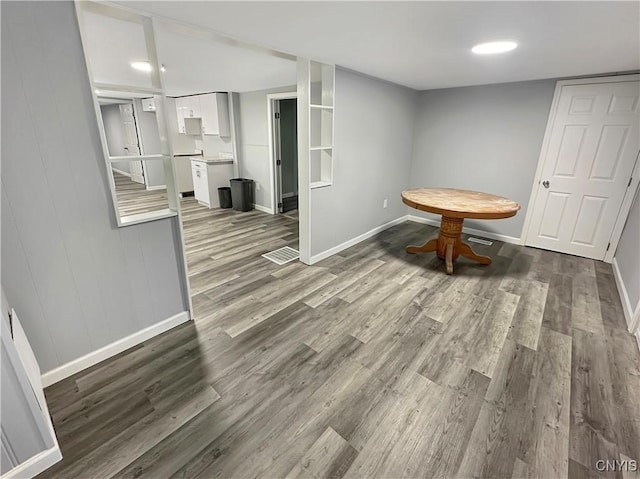 dining room with wood-type flooring