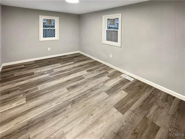 spare room featuring hardwood / wood-style floors