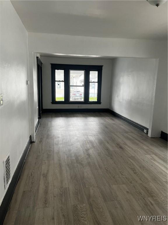 empty room featuring dark hardwood / wood-style floors