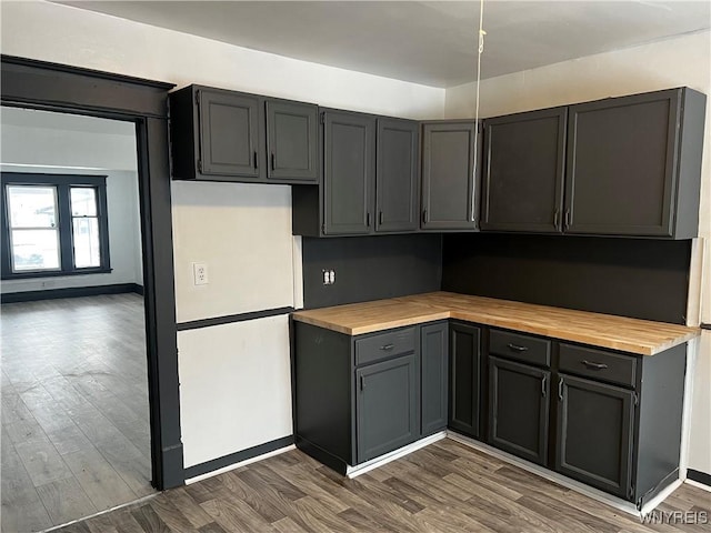 kitchen featuring wood counters and dark hardwood / wood-style floors