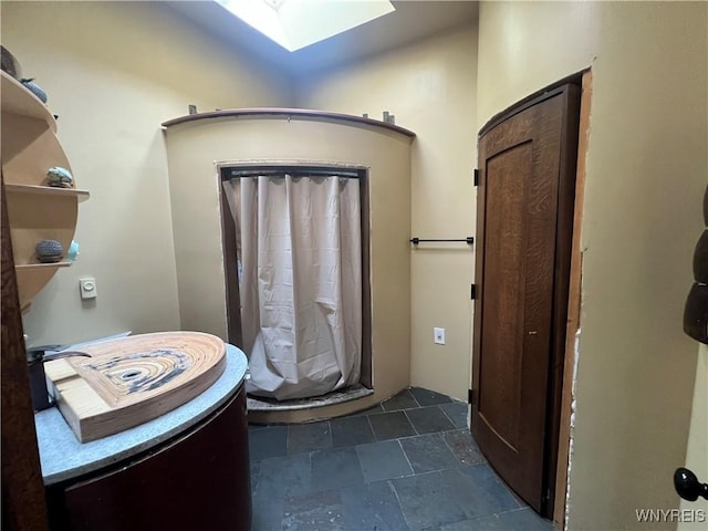 bathroom with a skylight