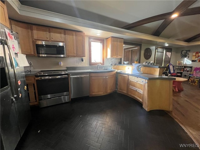 kitchen with beam ceiling, kitchen peninsula, sink, and appliances with stainless steel finishes