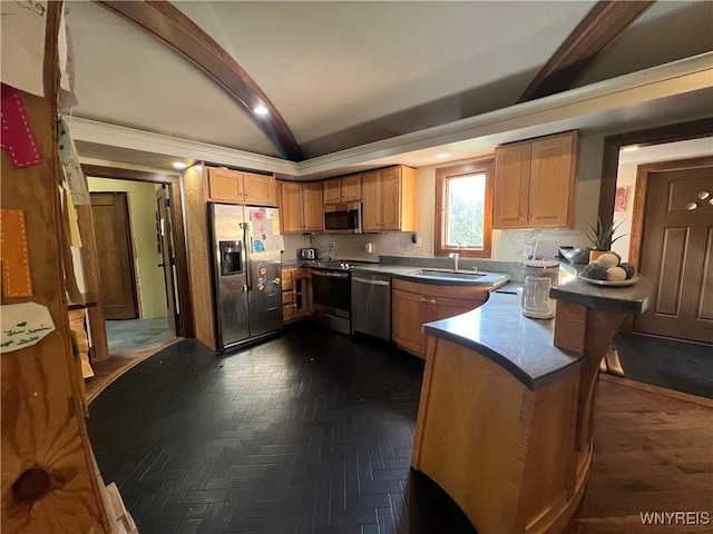 kitchen featuring sink, lofted ceiling with beams, and appliances with stainless steel finishes