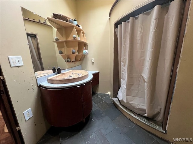 bathroom with vanity and curtained shower