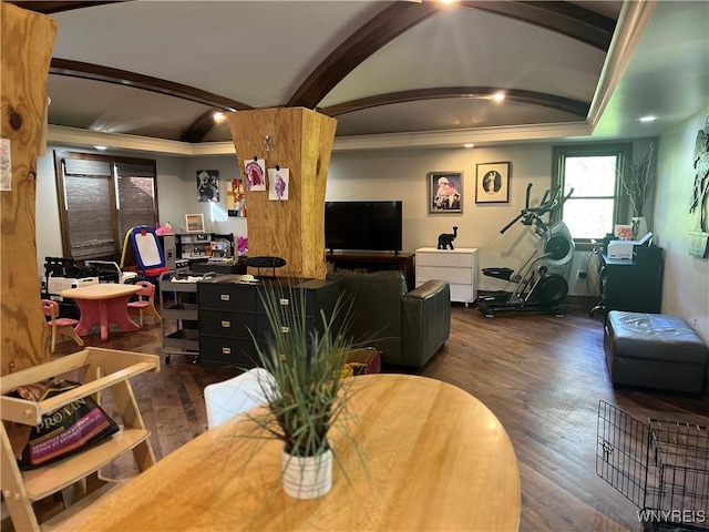 dining area featuring crown molding, dark wood-type flooring, and lofted ceiling