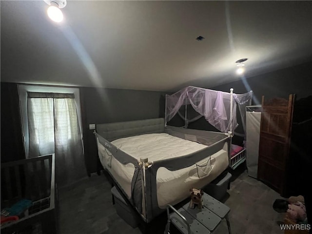 carpeted bedroom featuring vaulted ceiling