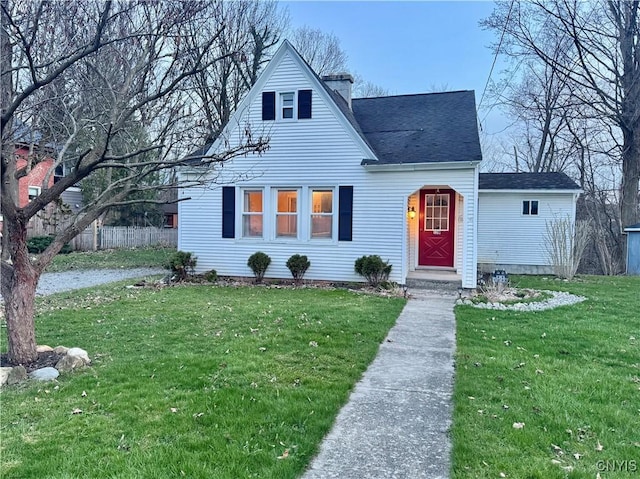 139 Owasco St, Auburn, NY 13021 - bungalow featuring a chimney, a shingled roof, fence, and a front lawn