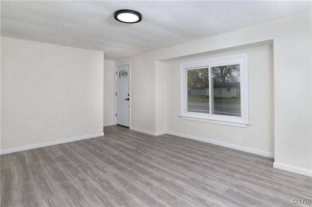 spare room with light wood-type flooring