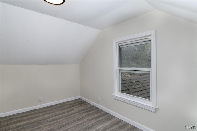 bonus room featuring lofted ceiling and dark wood-type flooring