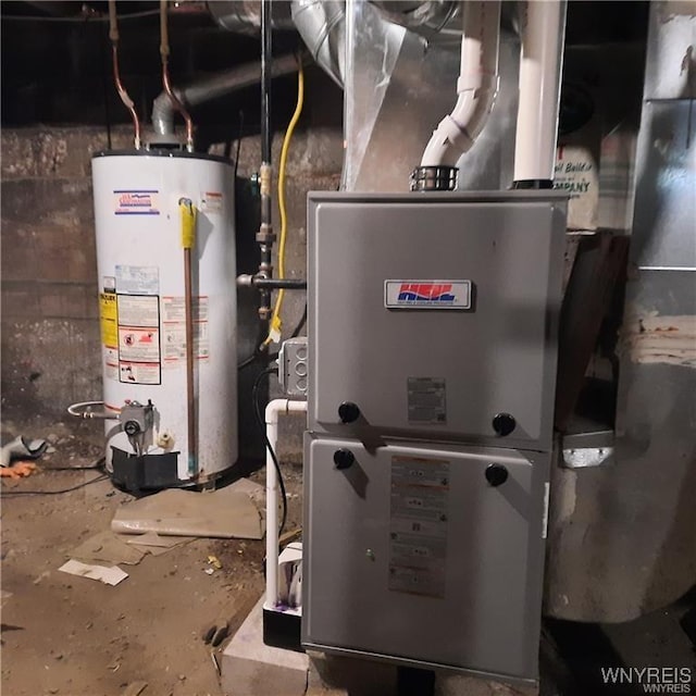 utility room featuring gas water heater